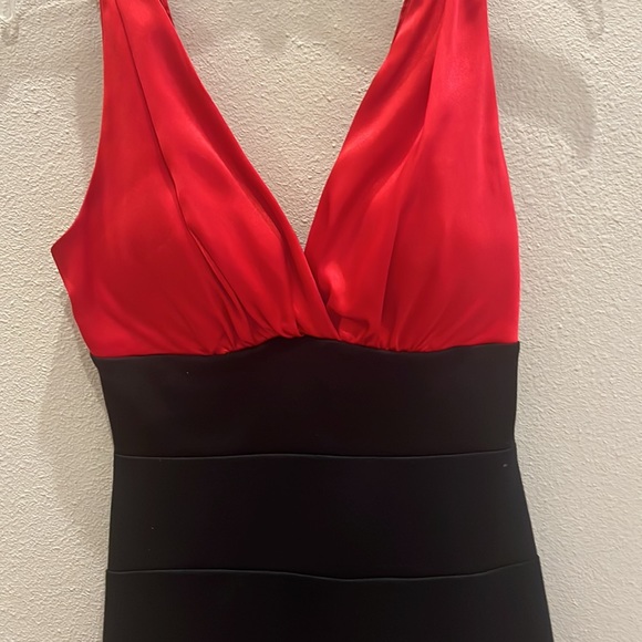 A black and red v-neck tighter fitted dress. It is pretty fancy. - Picture 3 of 3